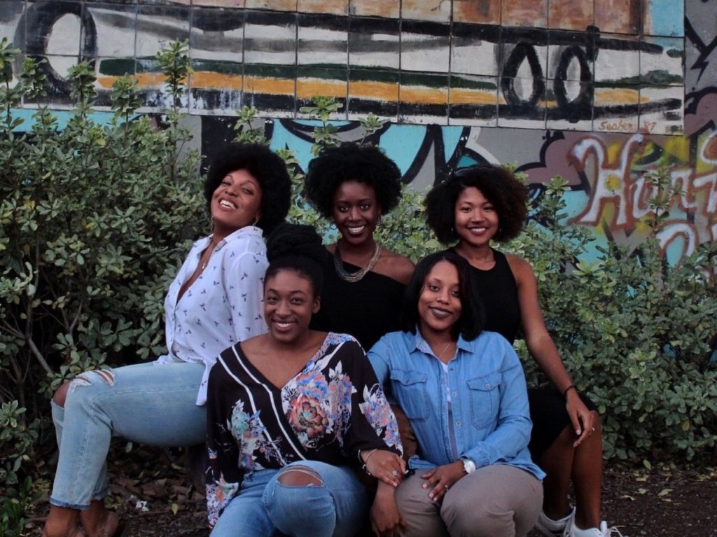 Group of black female friends posing for a photo